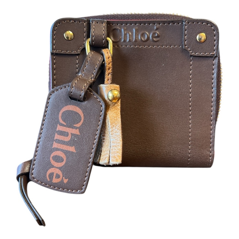 NWOT Chloé Eden zip-around wallet in brown leather with red interior.
